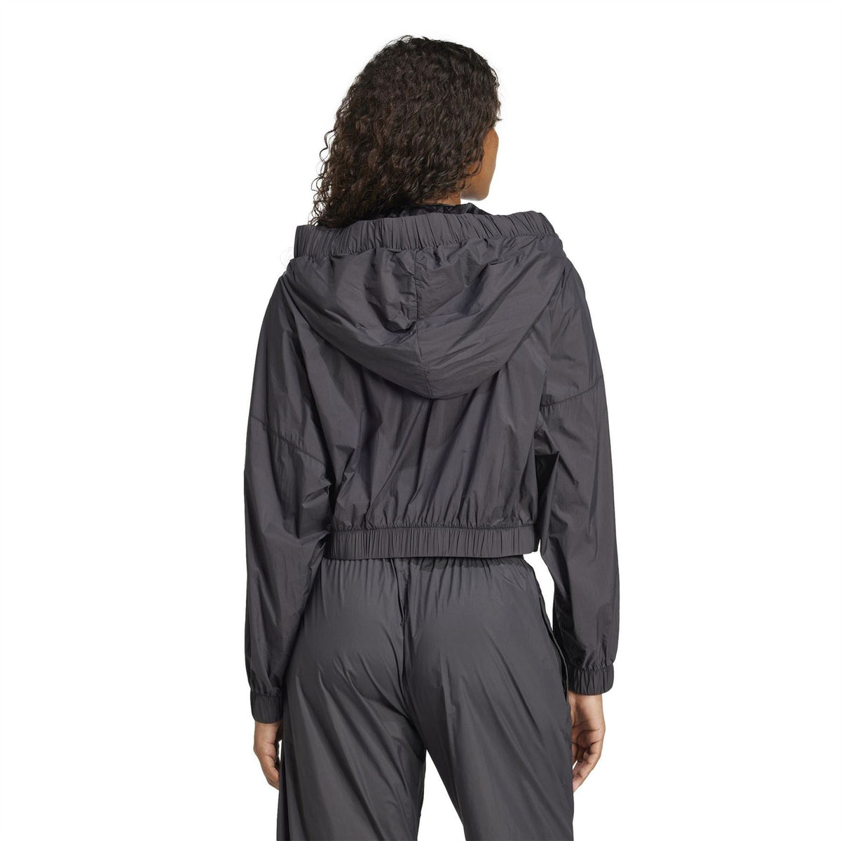 Black ruched hooded bomber jacket viewed from back with elastic waist band