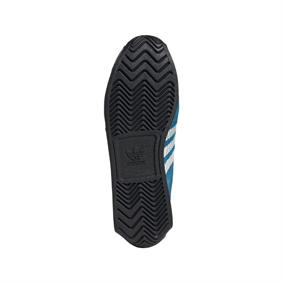 Rubber outsole for teal and dark sneakers with zigzag tread pattern