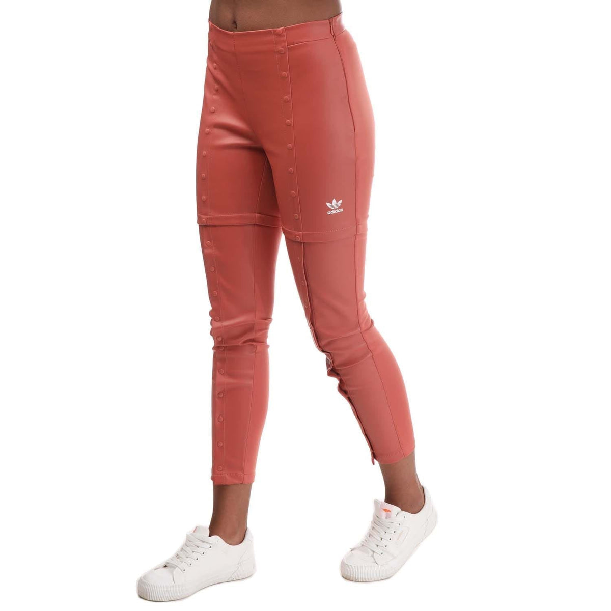 Red slim snap-button pants with adidas logo and stitched seams