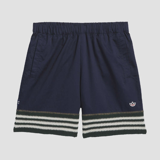 Indigo knit shorts with elastic waistband and striped hem, trefoil logo