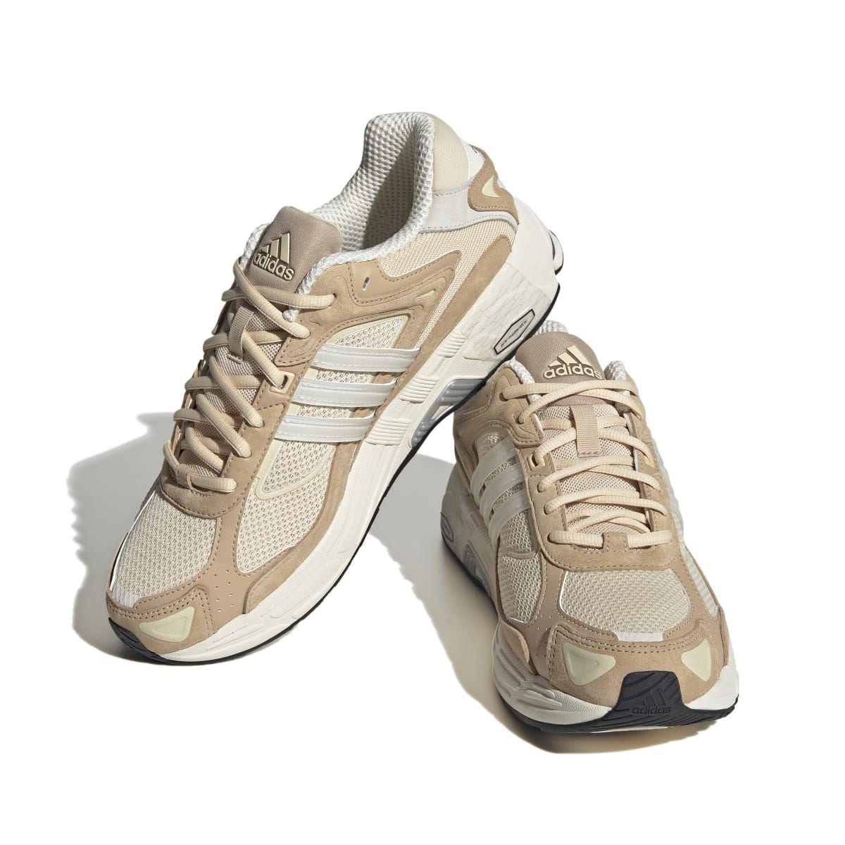 Sand and off-white trainers in angled view with lace-up closure and white midsole unit