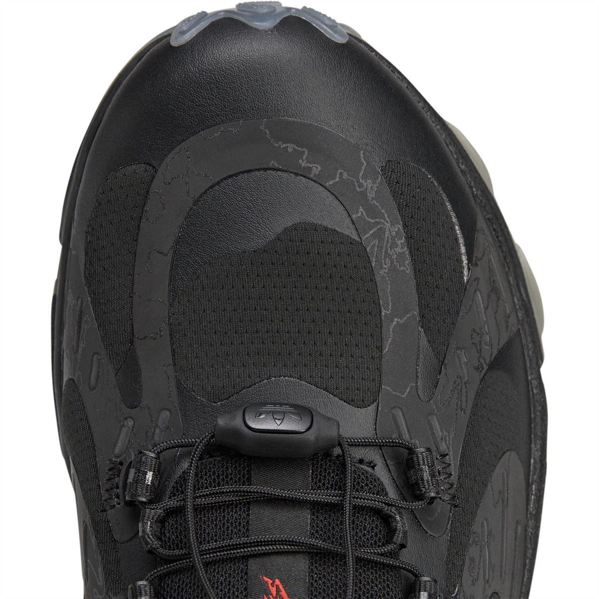 adidas Originals 100t Savage footwear showing stylish sneaker with textured details and classic design in a side view