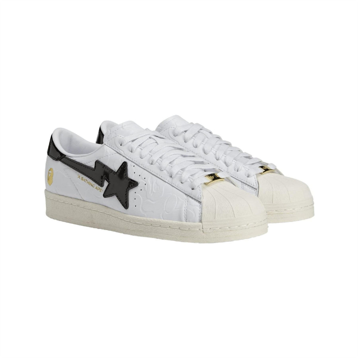 White Adidas Originals SSTR sneaker side angle with black star logo and gold accents