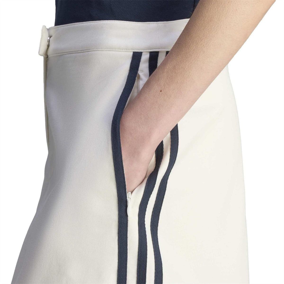 Core White skirt close-up with navy side stripe and sporty & rich logo