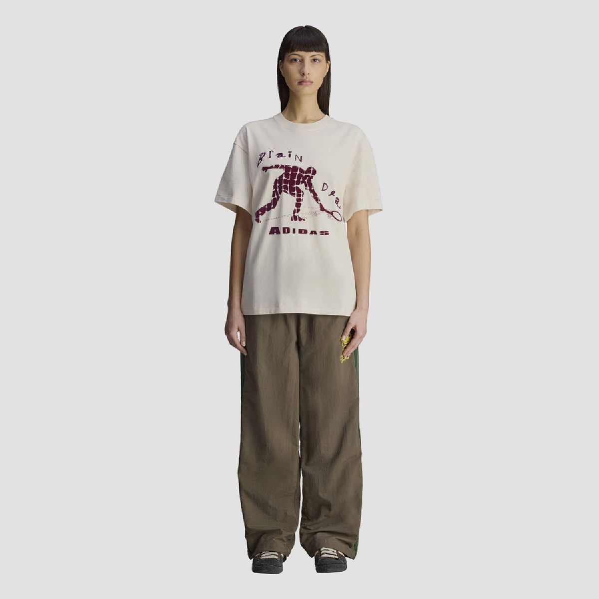 Chocolate track pants with elastic waist, green side stripes, straight wide fit