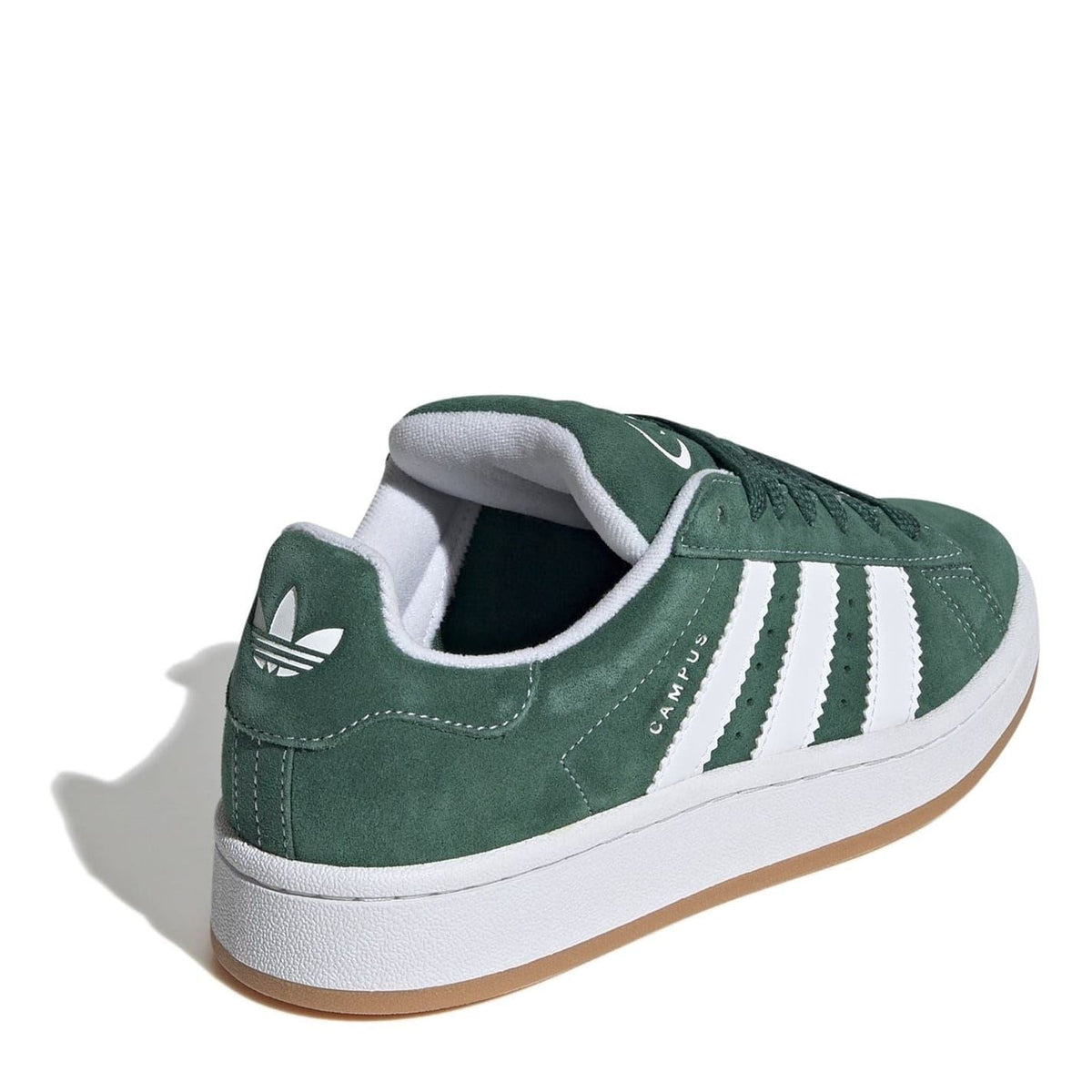 Juniors green suede trainers with white side stripes, white sole, padded collar.