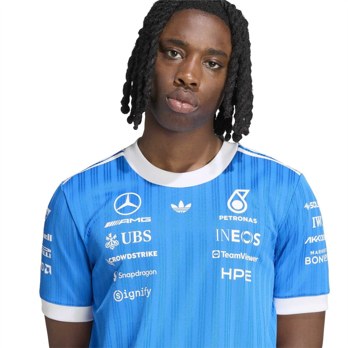 Blue graphic jersey T-shirt with white-trim crew neck and front sponsor logos