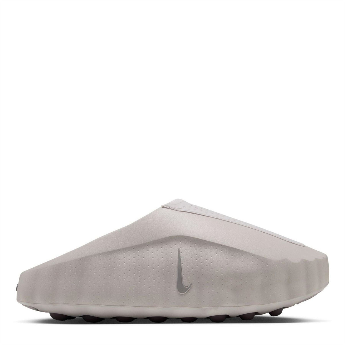 Light gray Nike slide sandals with perforated upper and sculpted rubber sole