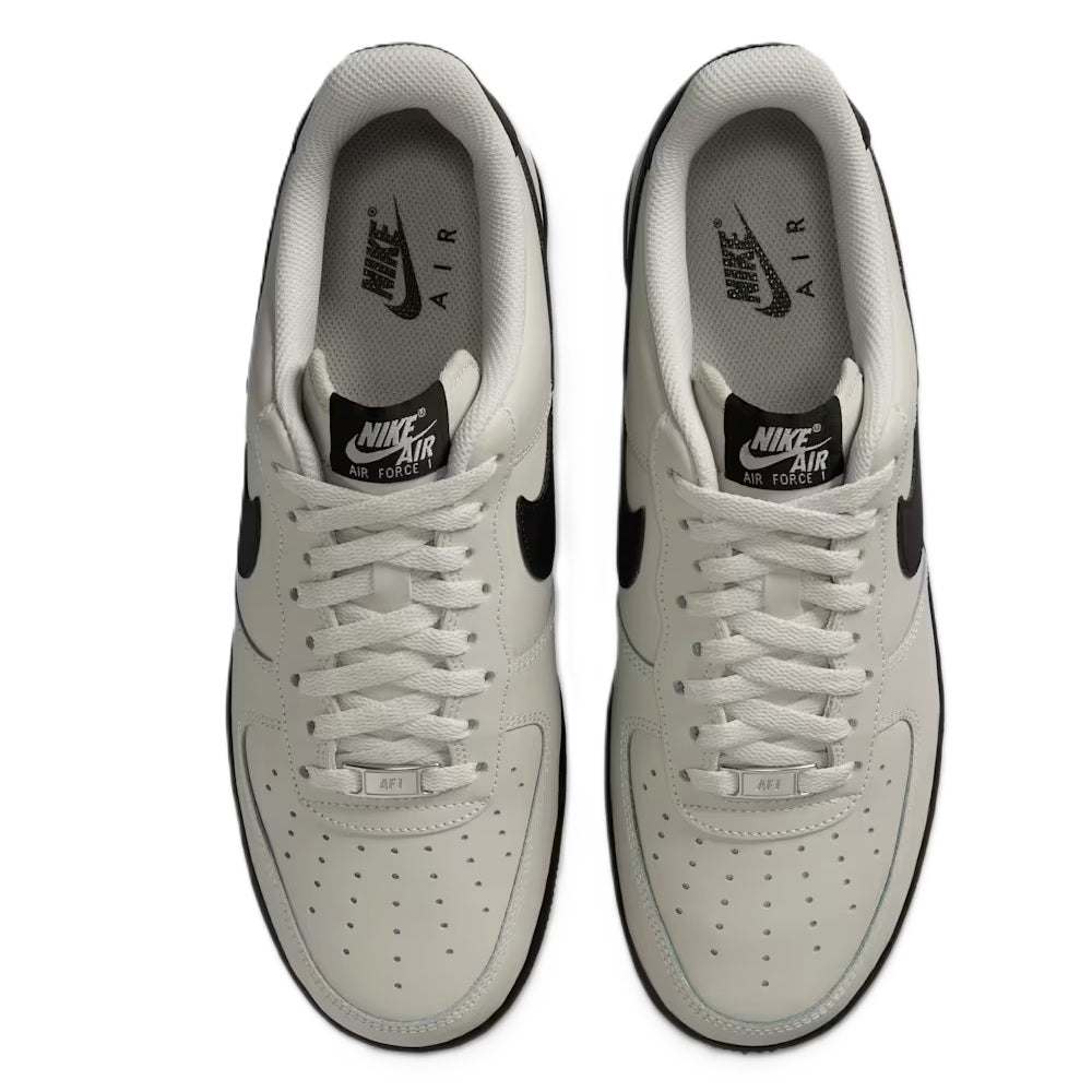 Nike Air Force 1 '07 low-top sneakers top view, light bone laces and black Swoosh accents