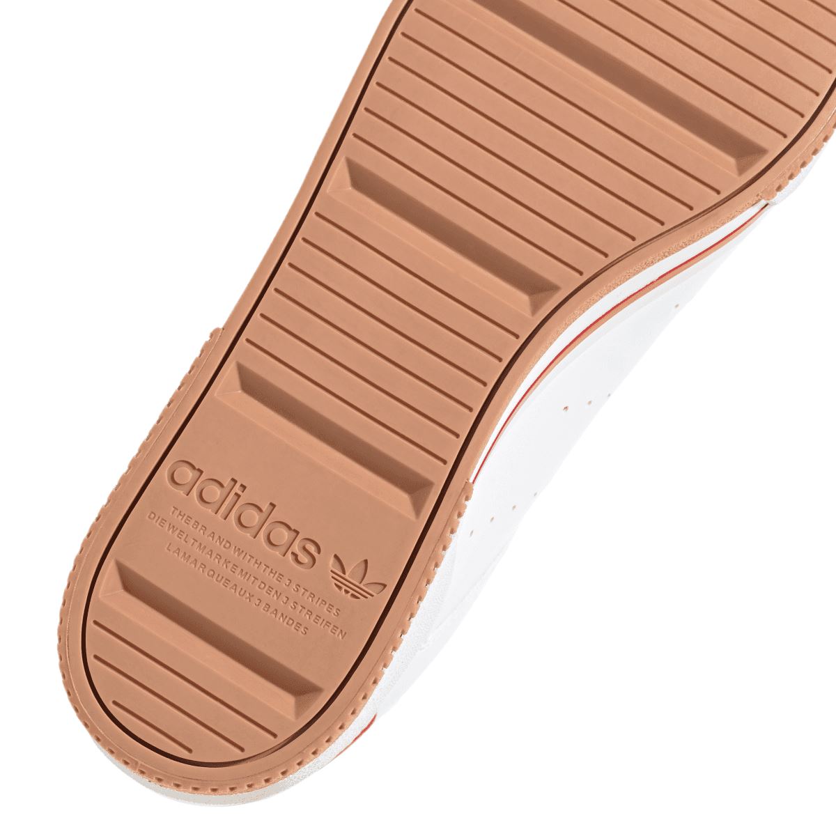 Close-up of brown gum outsole with ridged tread and adidas text