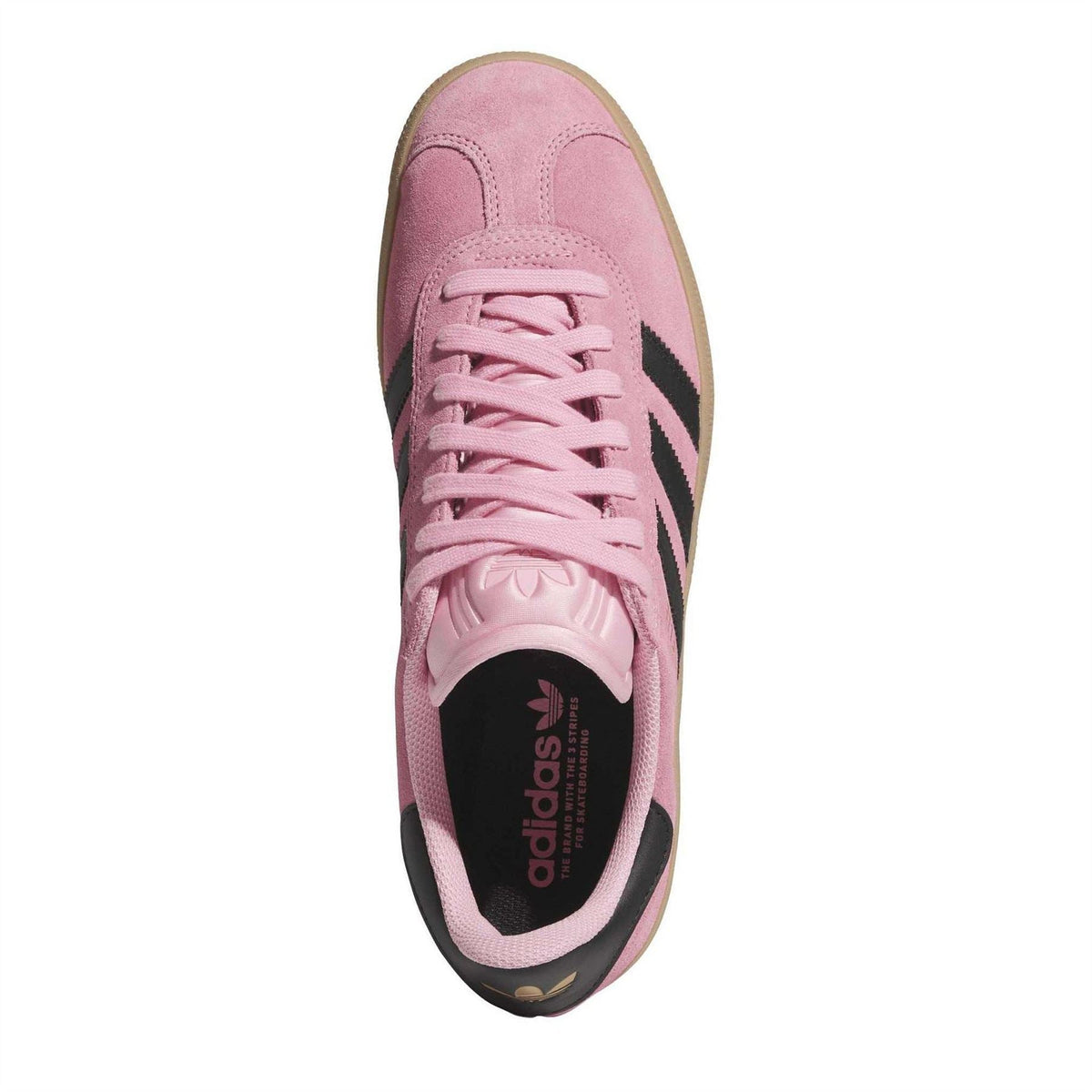 Light pink suede trainers with pink laces and black adidas heel logo