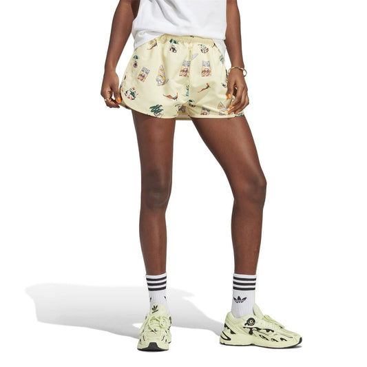 Cream athletic shorts with shirred elastic waist and multicolor comic print