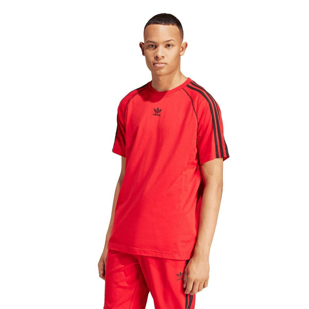 Red adidas Originals T-shirt with black shoulder stripes and small chest logo