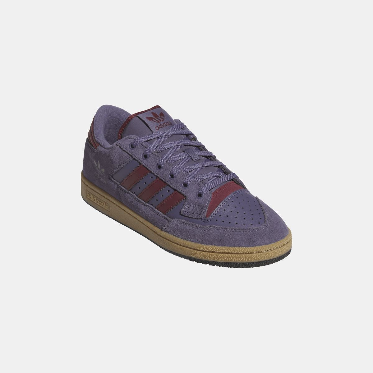 Violet suede adidas Originals low-top shoe angled view with lace eyelets and gum sole