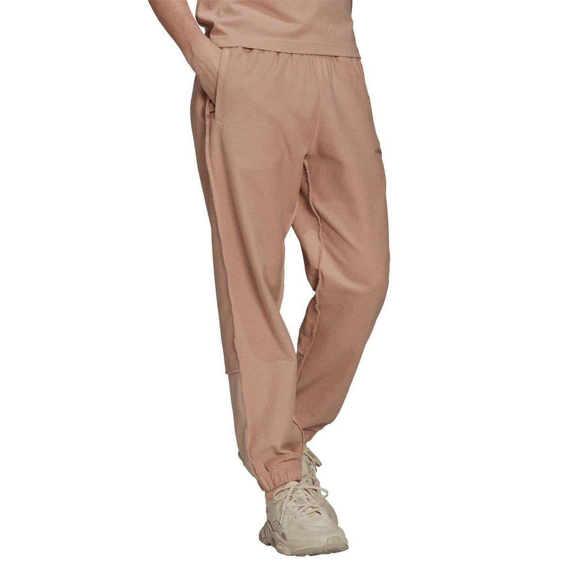 Dusty pink jogger pants with side pockets and cuffed hem