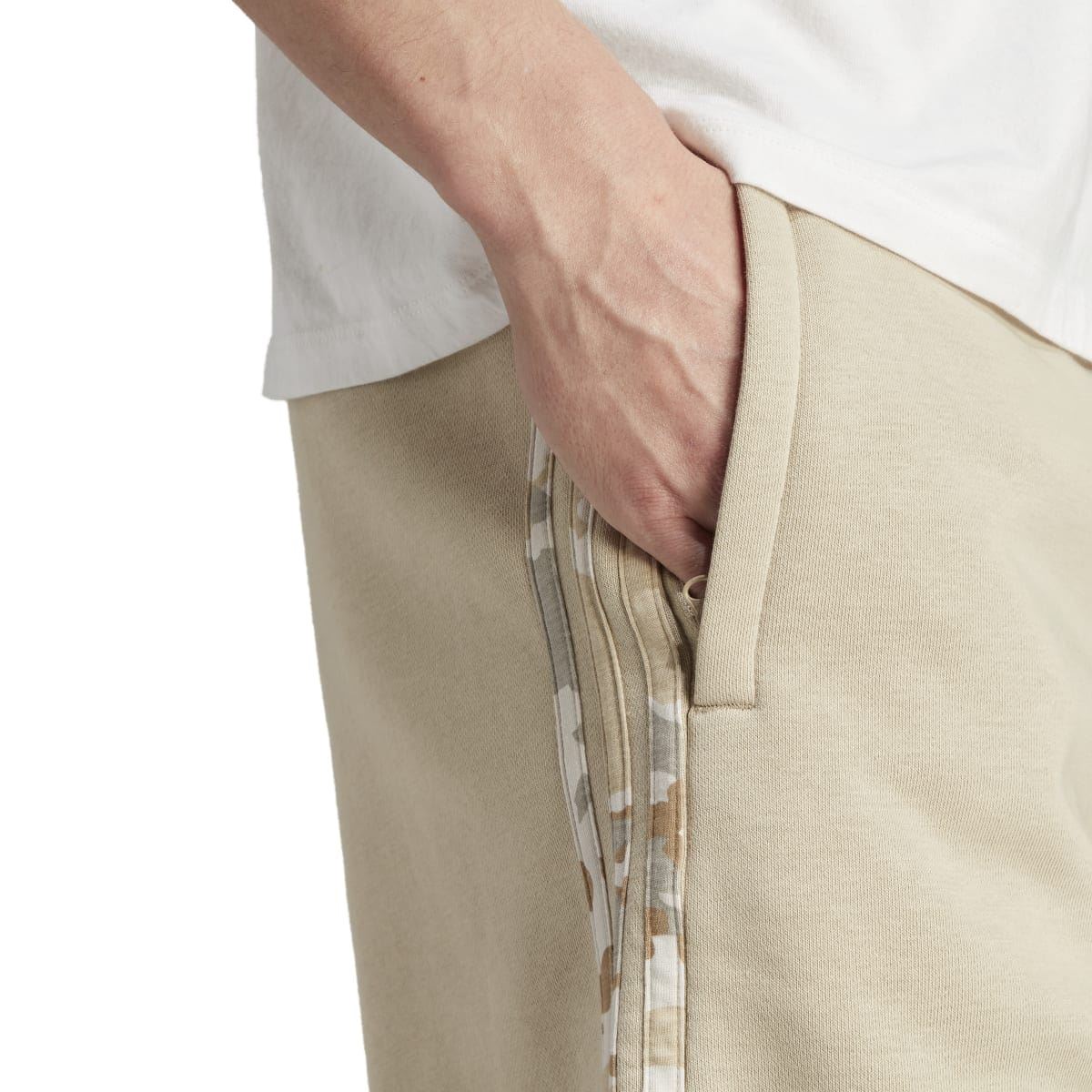 Close-up of front pocket and drawstring area on sand camo stripe shorts