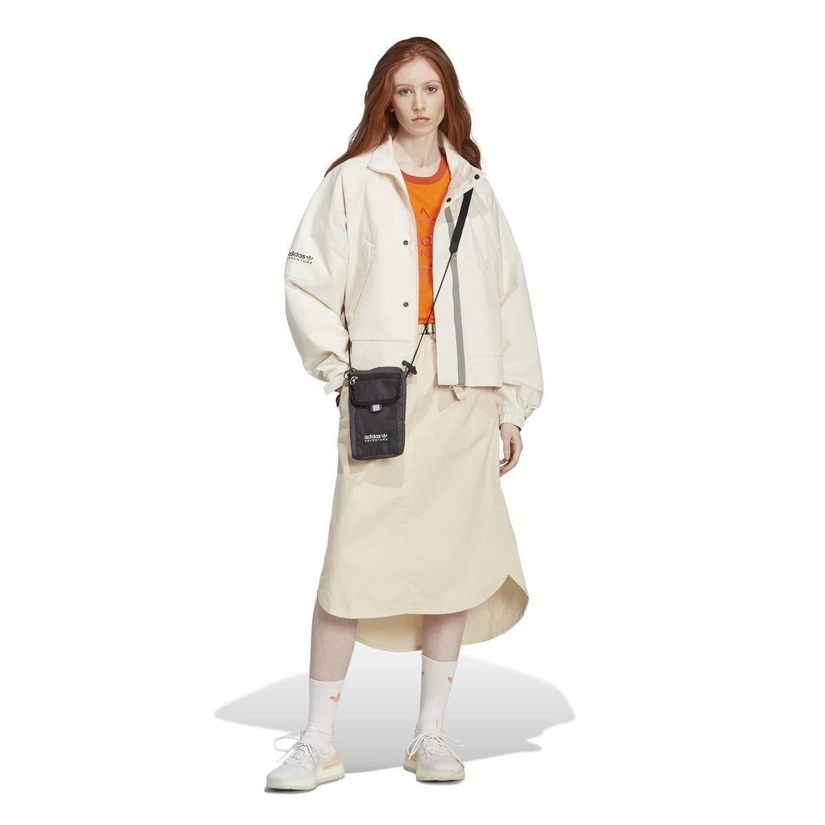 Light beige adidas Originals midi shorts with elastic waist and drawcord hem