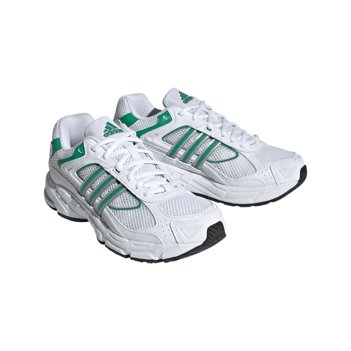 Two white low-top trainers with green stripes, white laces, and chunky cushioning