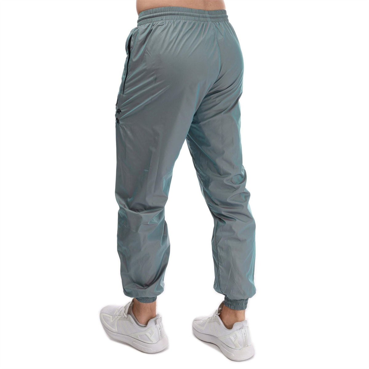 adidas Originals track pants, teal, elastic waist and cuffed ankles; side view