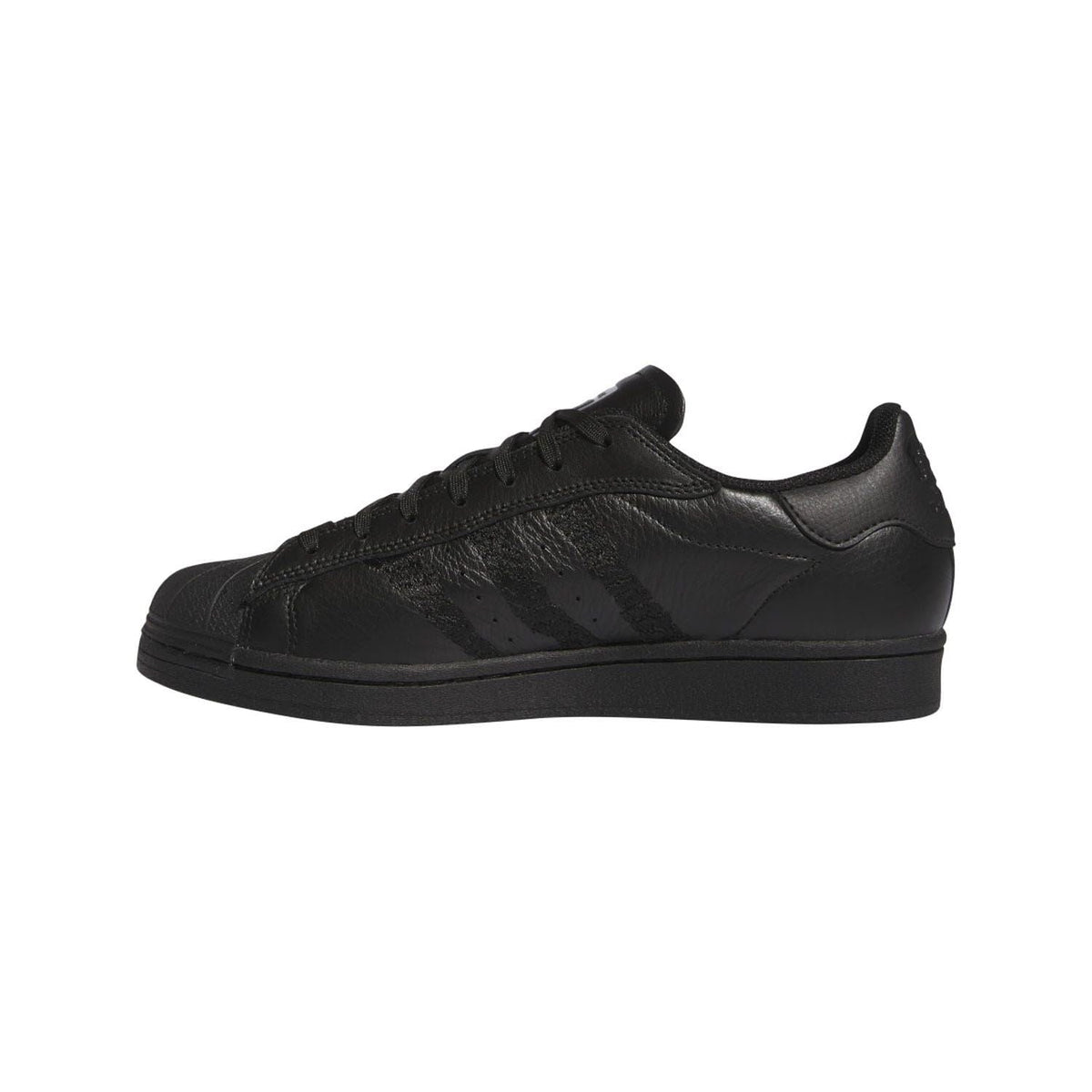 Black low-top trainers, side view, lace-up with glossy textured panels
