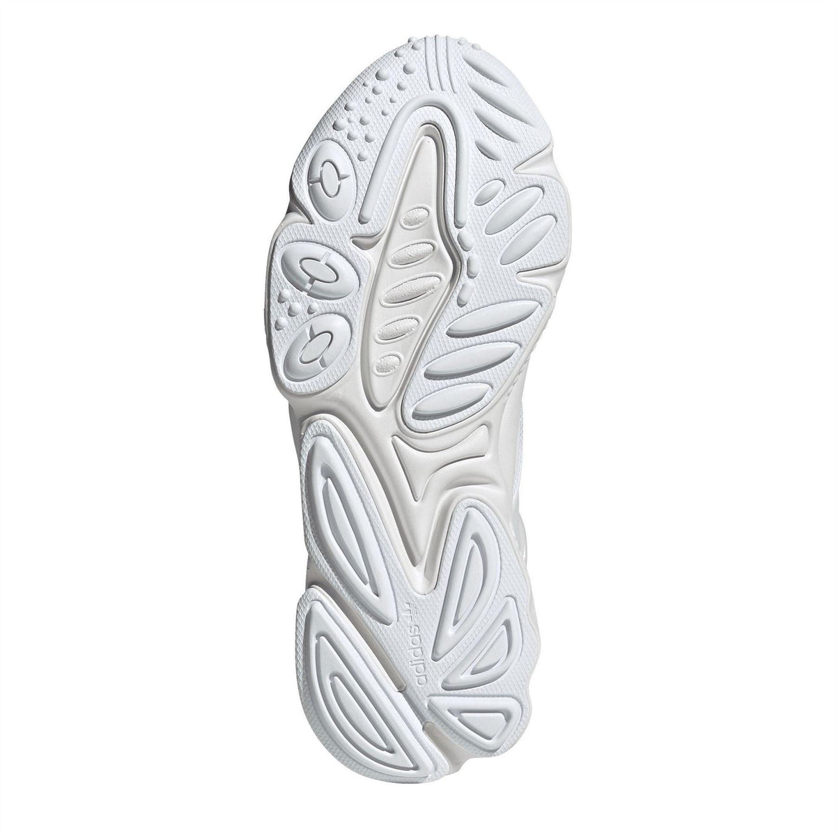 adidas Originals Ozweego low-top trainers with mesh and synthetic upper, white and beige colorway, and chunky sole design.