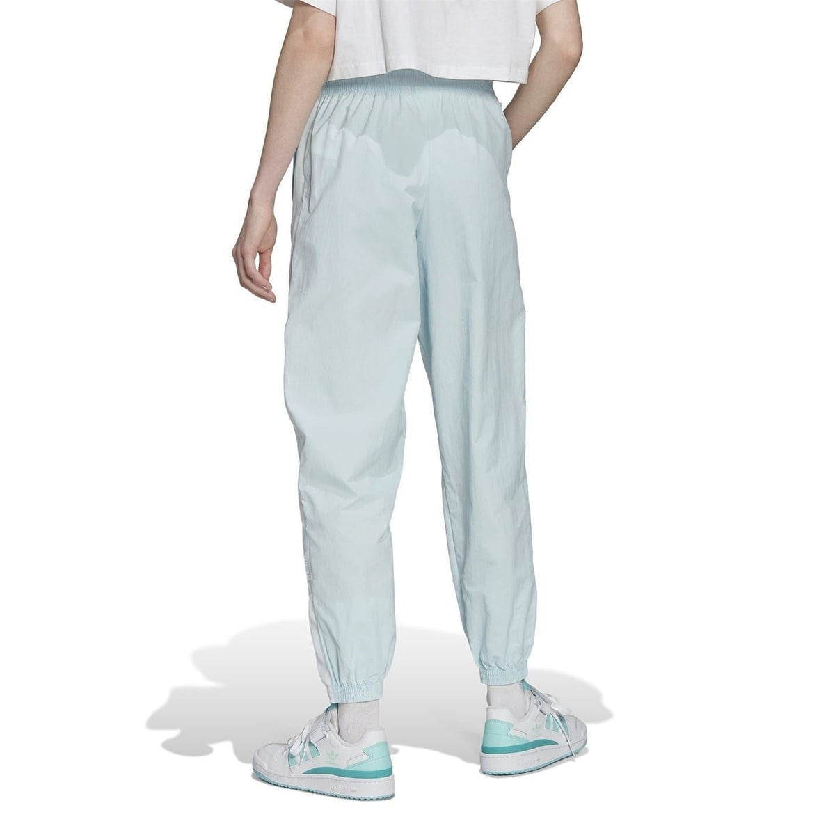 Light blue tapered track sweatpants with cuffed ankle and elastic waistband