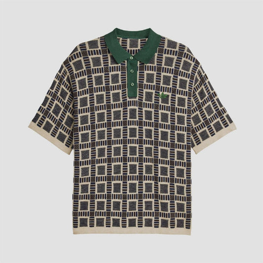 adidas Originals polo shirt in sand with dark geometric pattern and green button placket