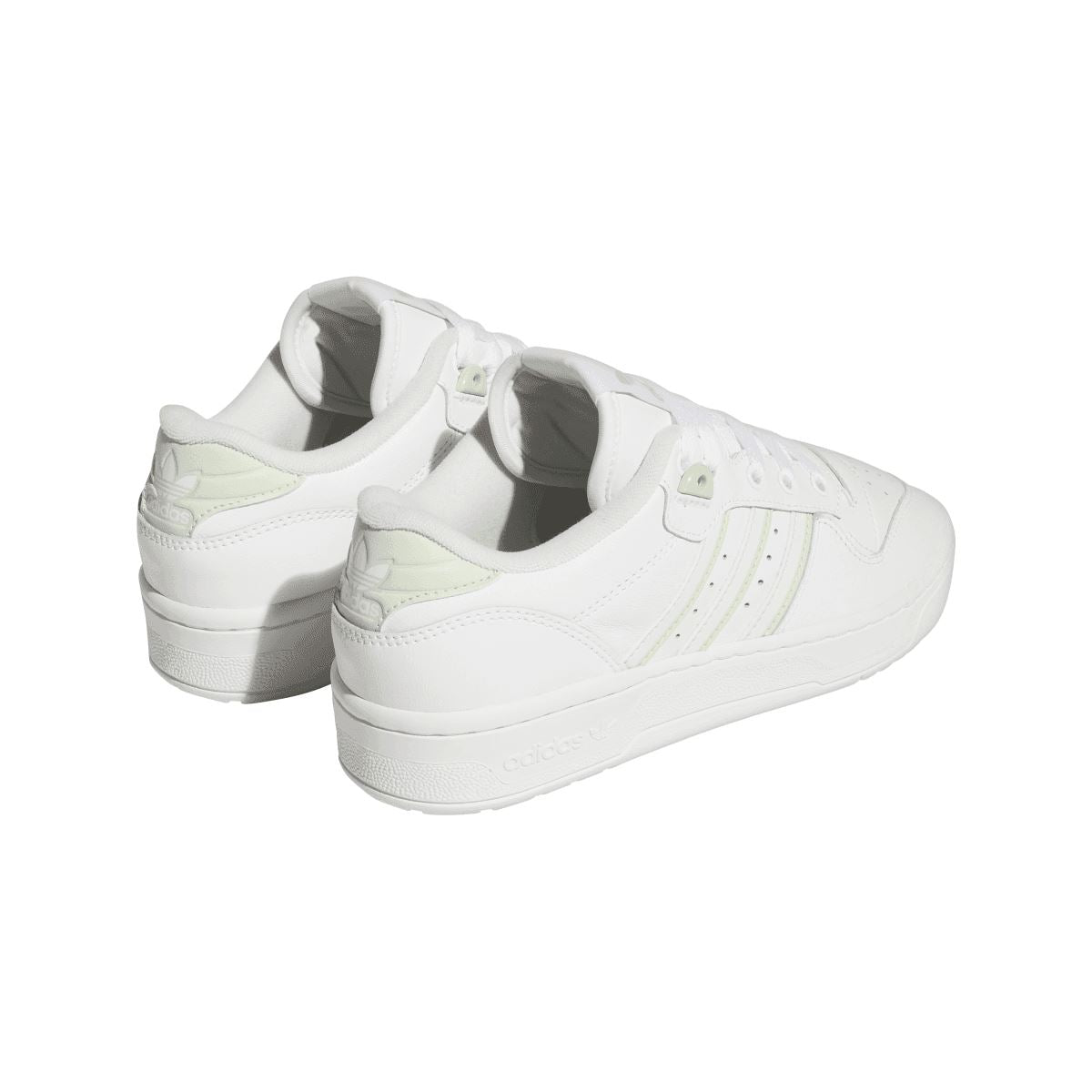 White low-top trainers viewed from the heel, with cushioned back and side stripes