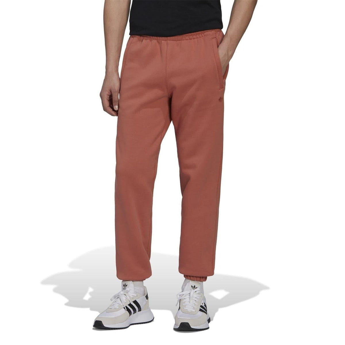 adidas Originals brown straight sweatpants, side view with slanted front pockets