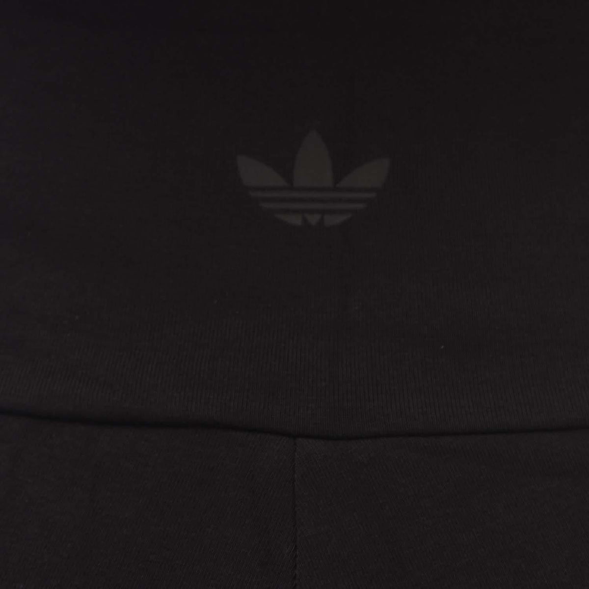 Black adidas Originals leggings with subtle trefoil logo on the hip