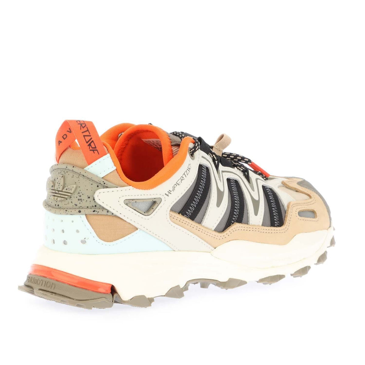 Cream trainers with orange collar lining, black laces, and beige suede overlays