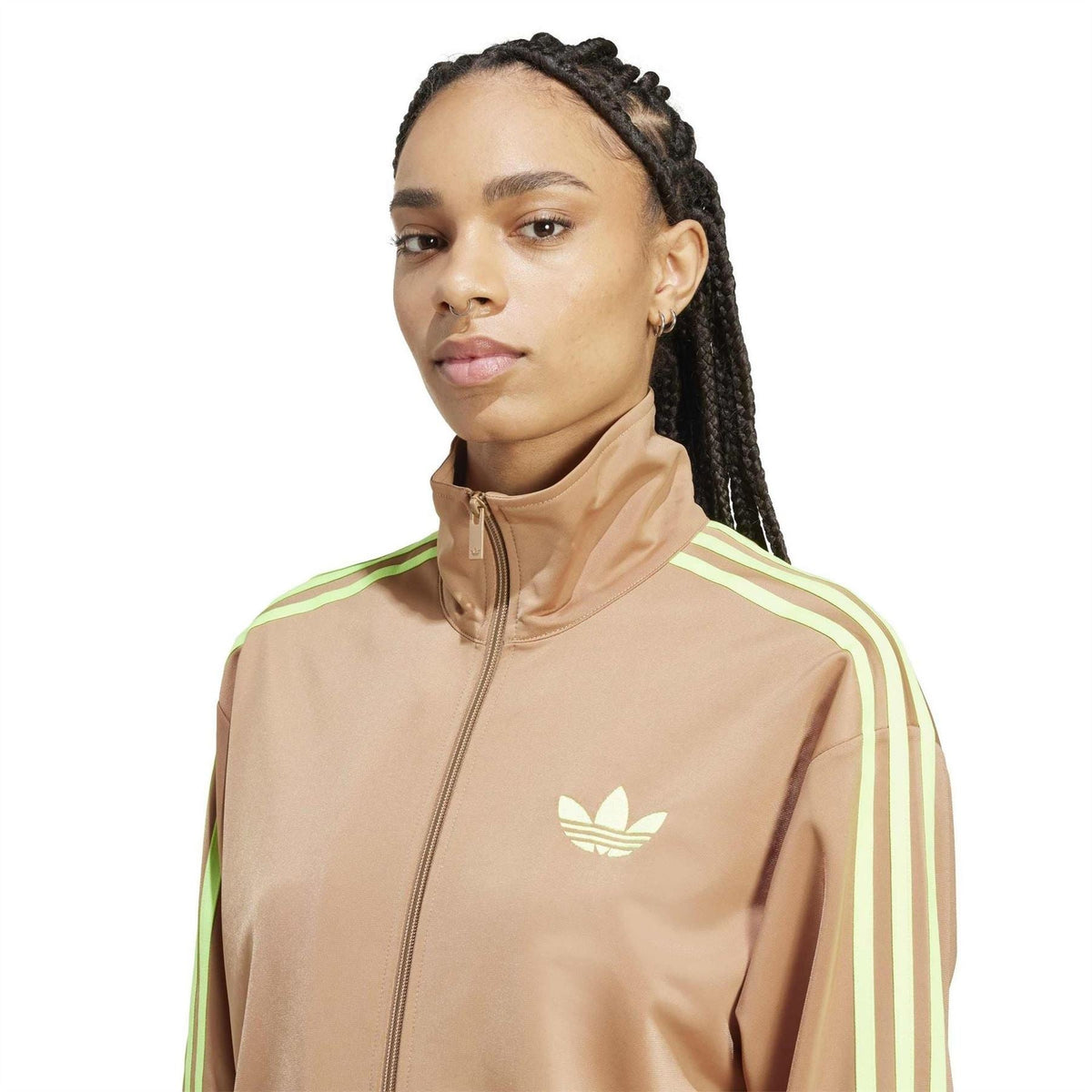 Tan track jacket with full zip, stand collar, trefoil chest logo, and neon green stripe shoulders