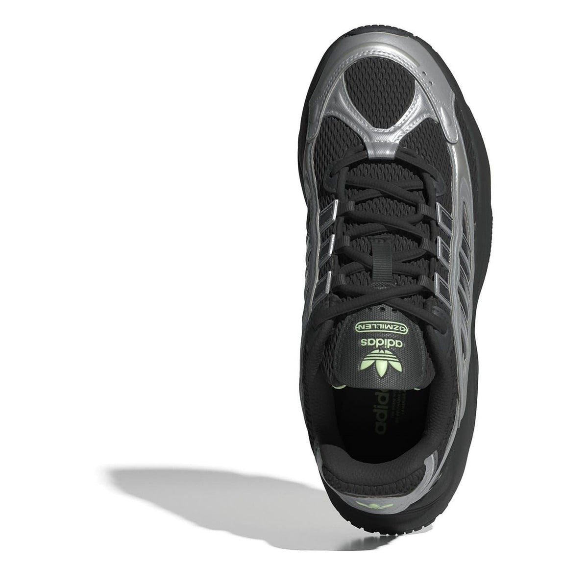 Low-top sneaker with black laces and tongue logo, silver toe cap and side stripes