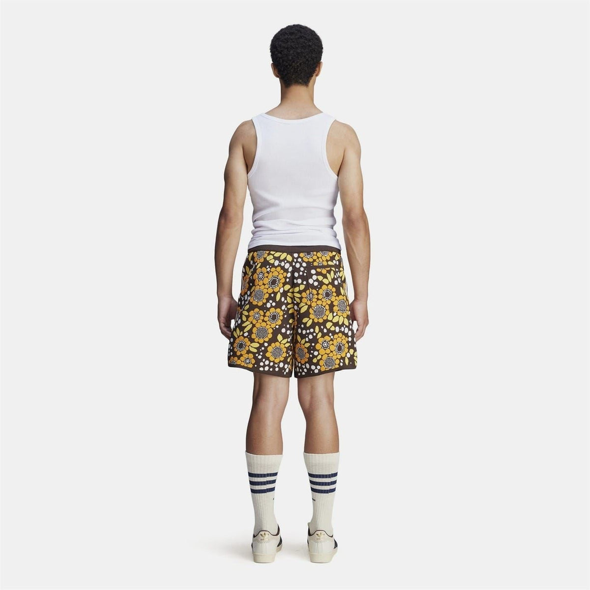 Back view of floral knit shorts with black background and multicolour flower print