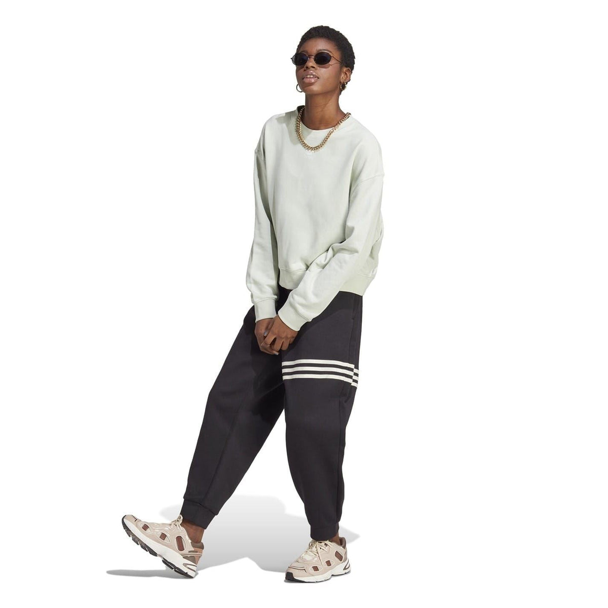 adidas Originals relaxed-fit crewneck sweatshirt, light green, front view with ribbed cuffs