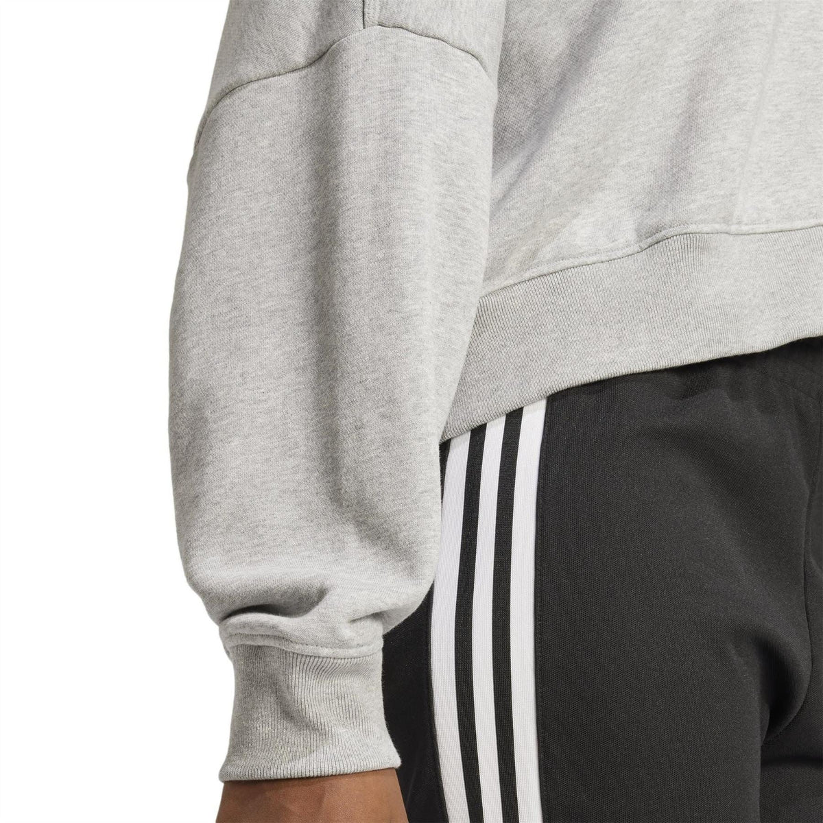 Light grey zip sweatshirt sleeve with ribbed cuff and side seam detail