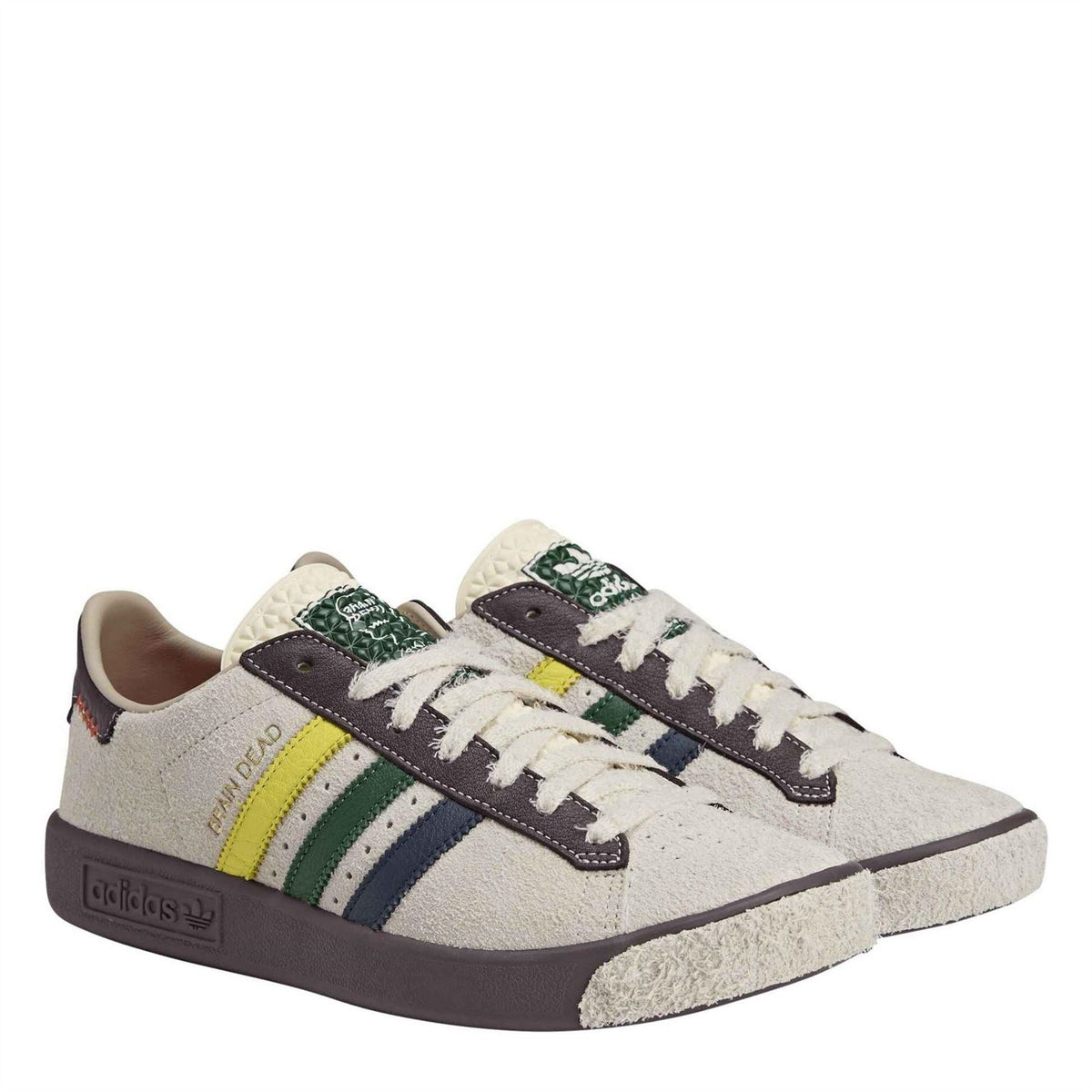 Low-top canvas sneakers with embroidered side patches and patterned laces