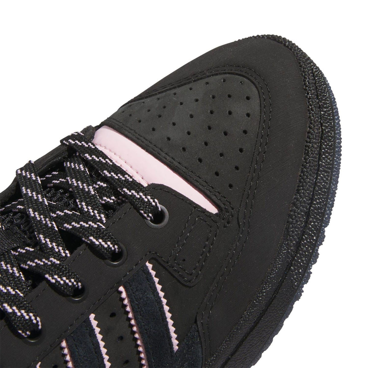 Black sneaker side panel with laces and perforated toe box detail