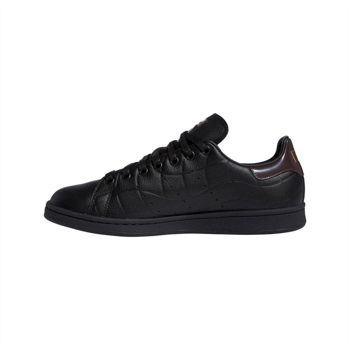 Black lace-up trainers with brown accent at collar and textured side panels