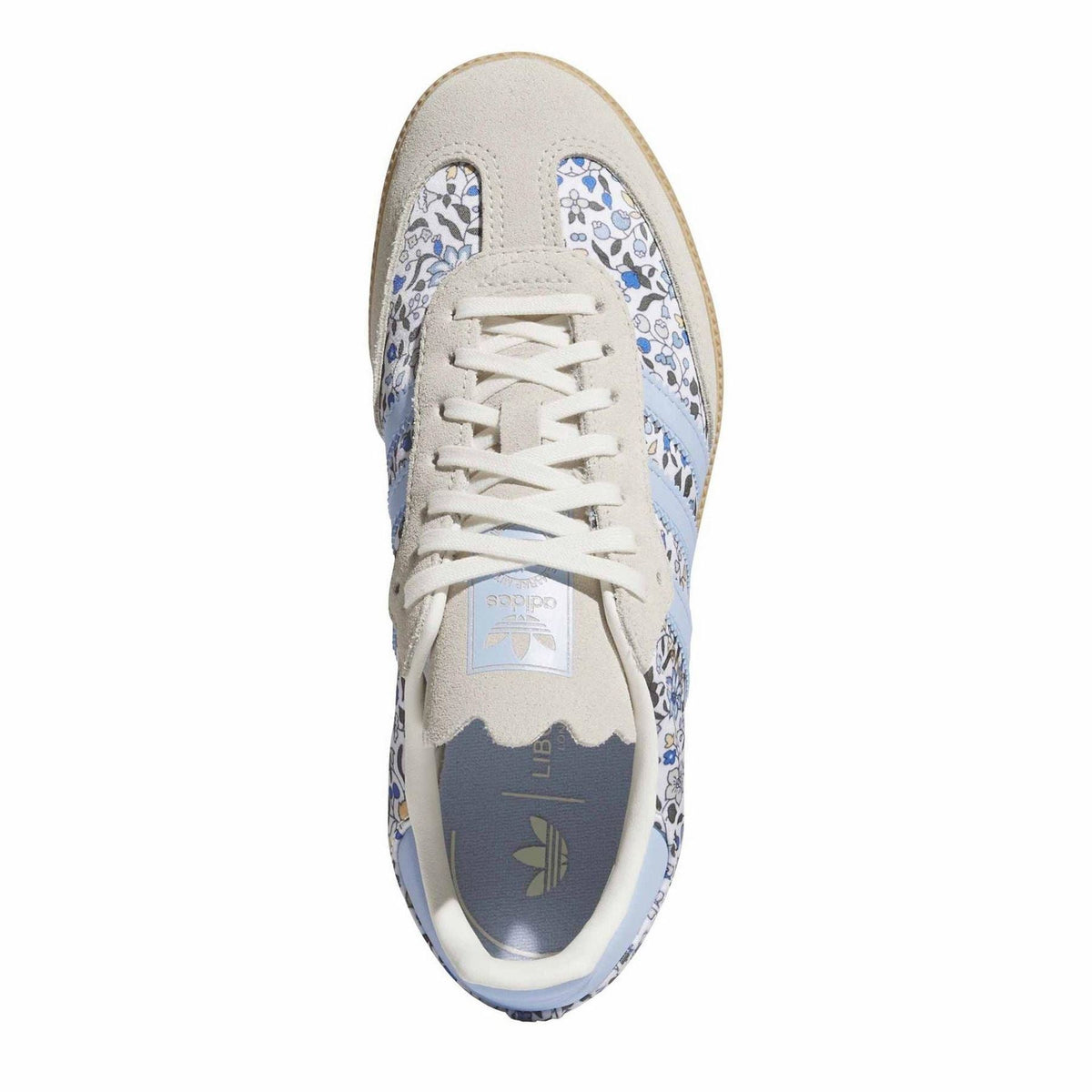 Juniors' Samba sneakers, front view with white laces and blue floral toe panel, gum sole