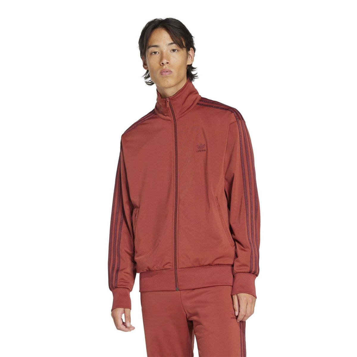 adidas Originals Firebird TT rust red track jacket, full-zip and stand collar on model