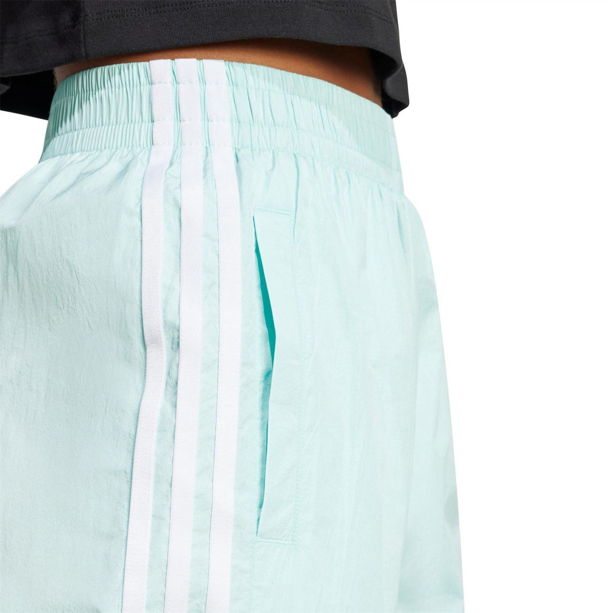 Light aqua track pants back view with ruched elastic waistband and side stripes