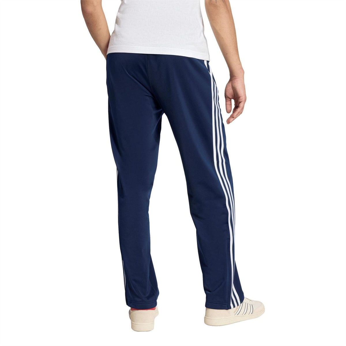 adidas men's navy woven track joggers with tapered legs and triple white side stripes