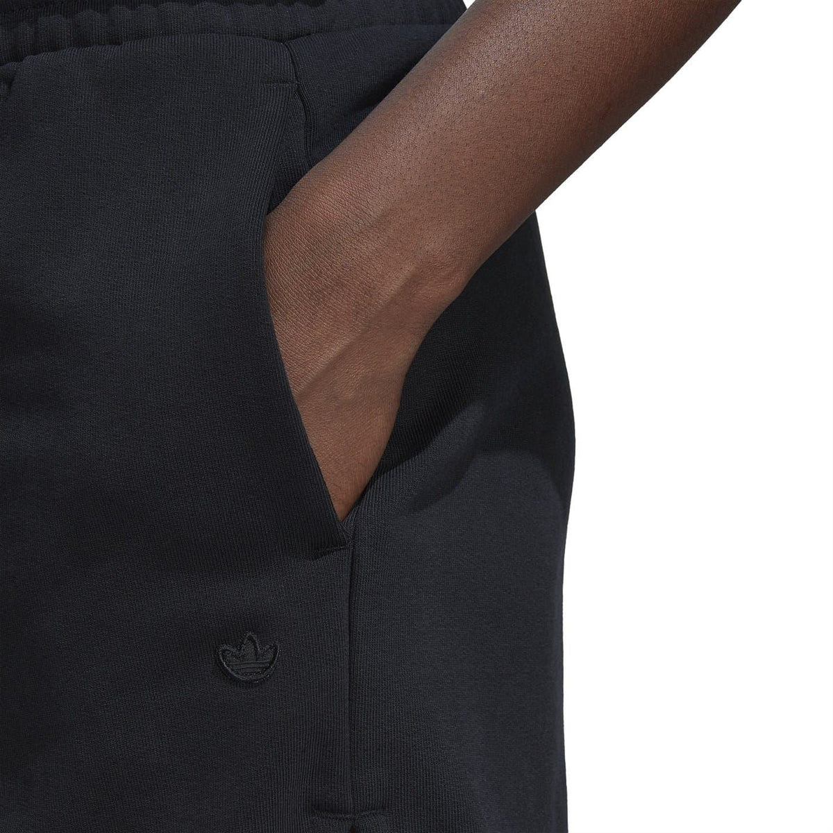 Black adidas Originals shorts close-up of embroidered logo on pocket