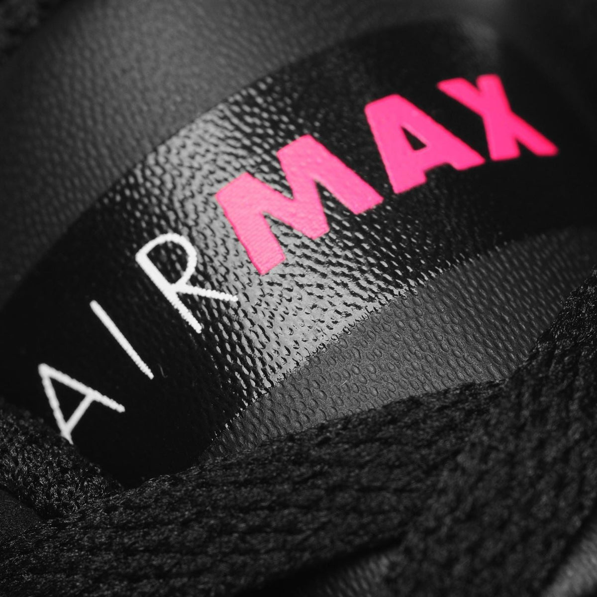 Kids' black Nike trainers with pink 'AIR MAX' logo detail
