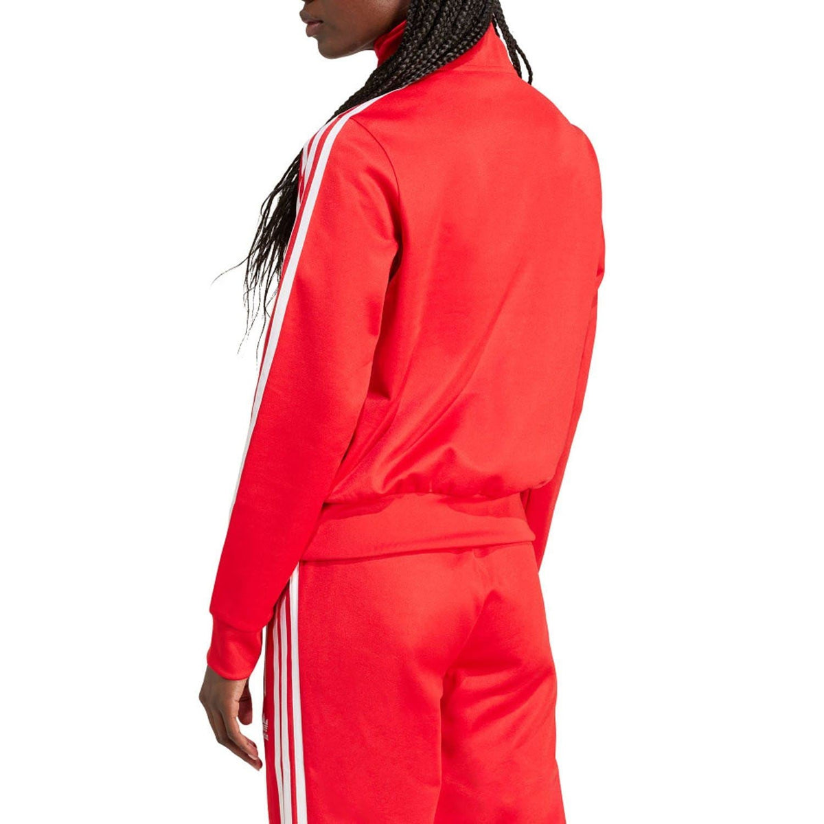 Red adidas track top side view with long sleeves and white triple stripes