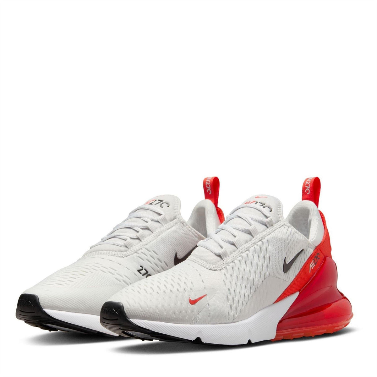 Nike Air Max 270 trainers in white mesh with red heel accents and visible Air unit