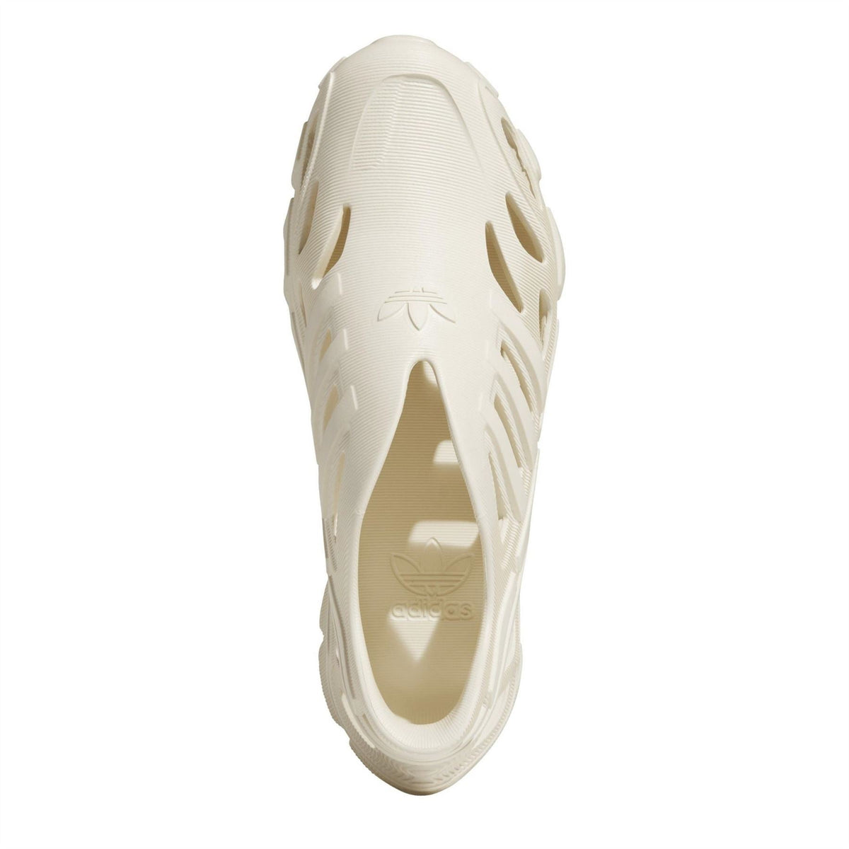 adidas Adifom Supern off-white sneaker top view showing molded cutouts and logo