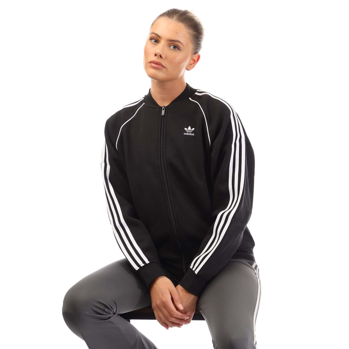 Black fleece bomber jacket with full zip, stand collar, and white 3-Stripes sleeves