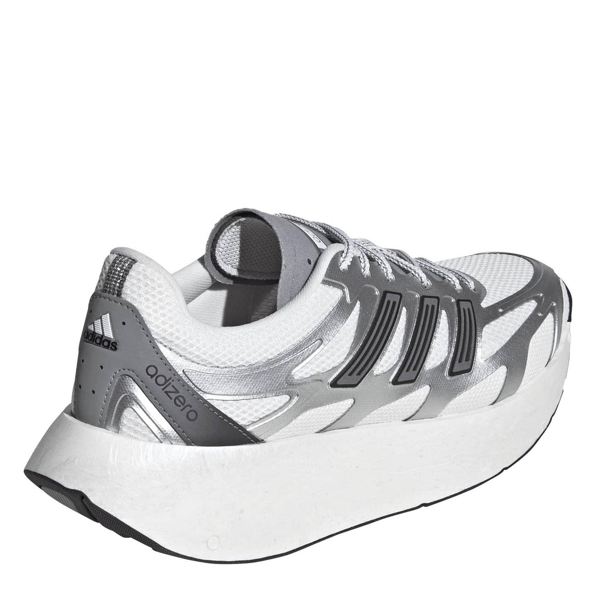 Silver and white low-top running shoe, heel and side detail with cushioned collar.